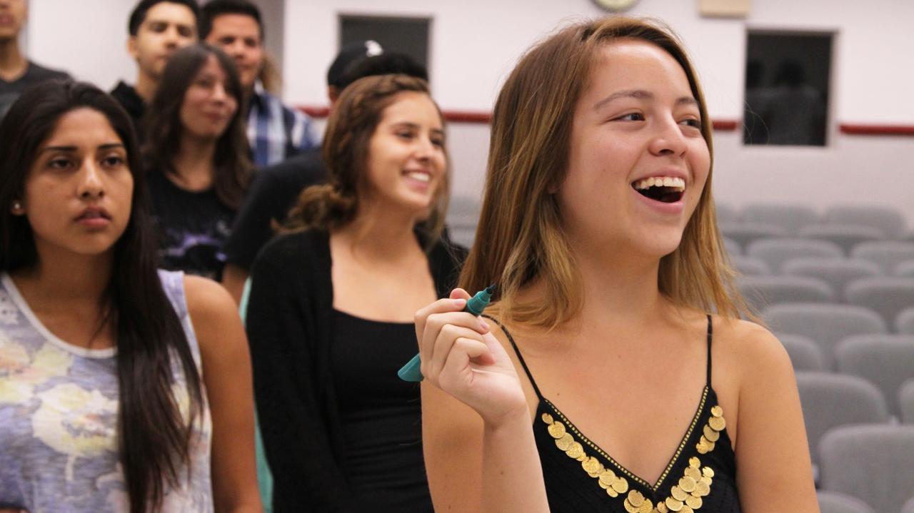 A group of students participate in a linguistics class.